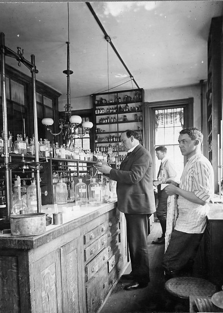 black and white pograph of people in an old fashioned bar