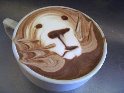 a latte featuring a brown cat is shown on a table