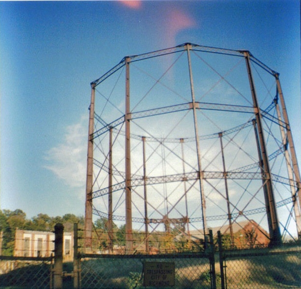 an old round structure with iron fencing