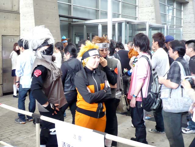 a group of people wearing some sort of costume and walking around