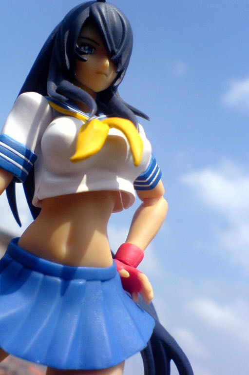 a toy doll posed wearing a sailor outfit