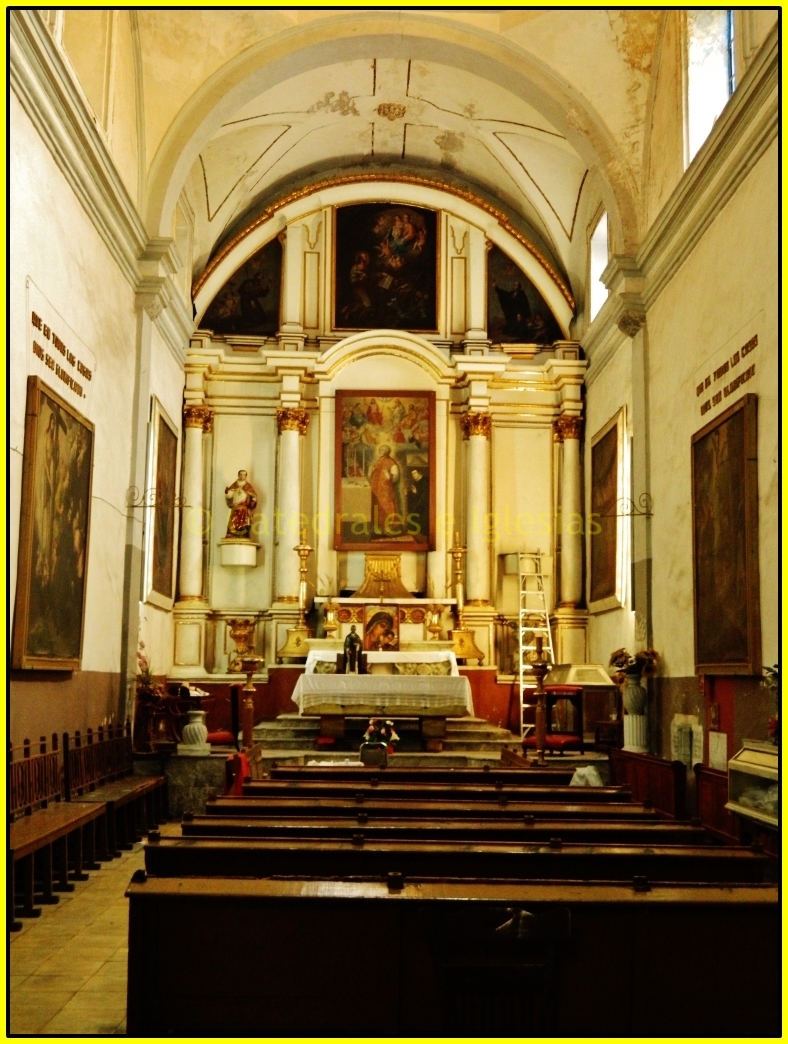 an ornate church with two altars is full of people