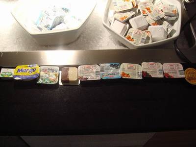 a buffet of snacks and milk are shown at a el