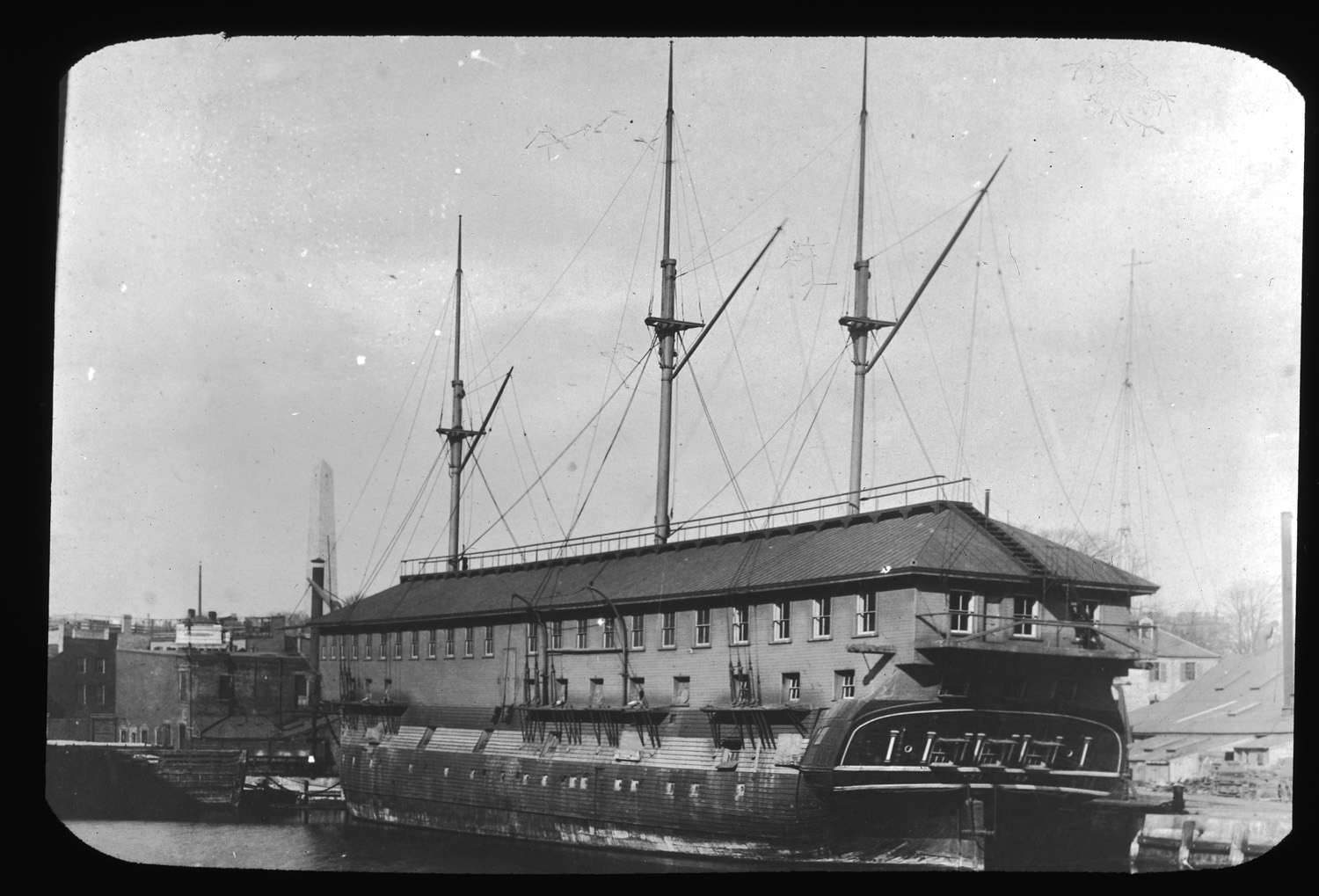 black and white po of a ship and its docked dock