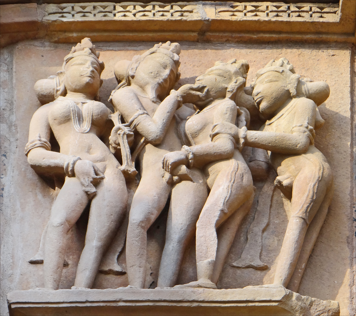 a wall statue of five women, one with an instrument