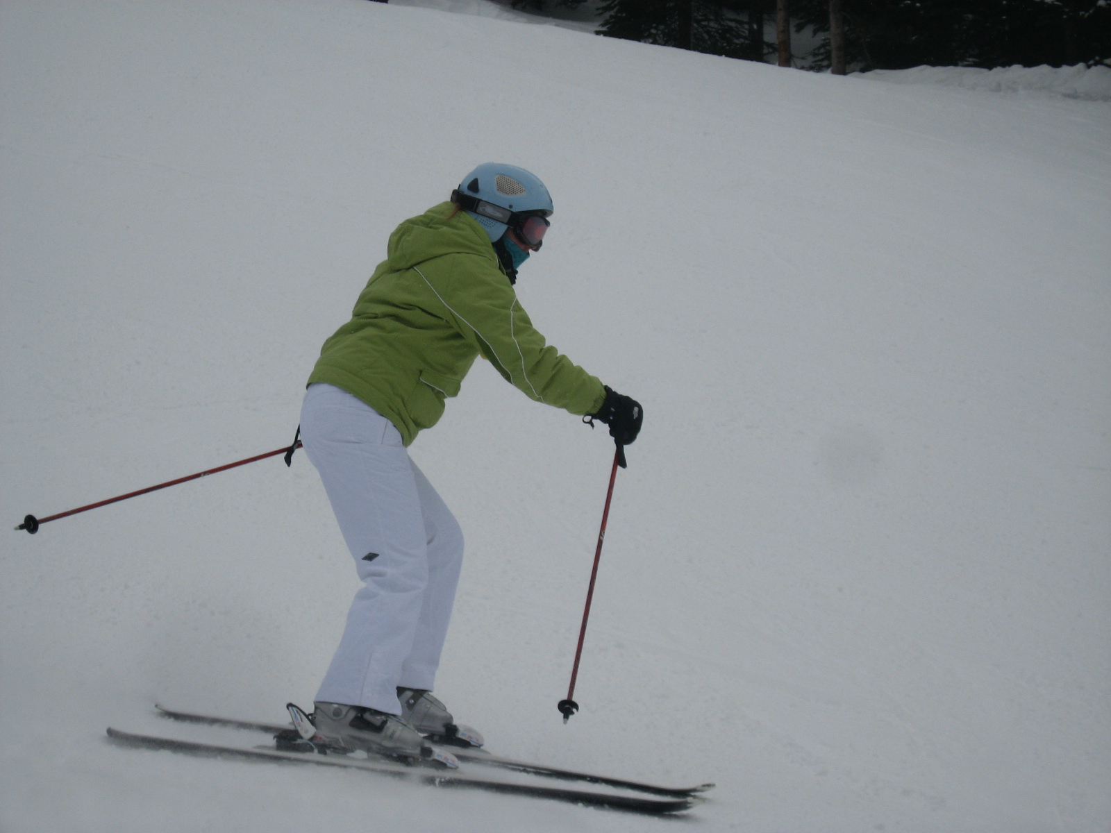 a person is skiing down a snowy hill