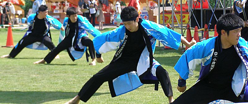 dancers performing an asian dance routine in a carnival