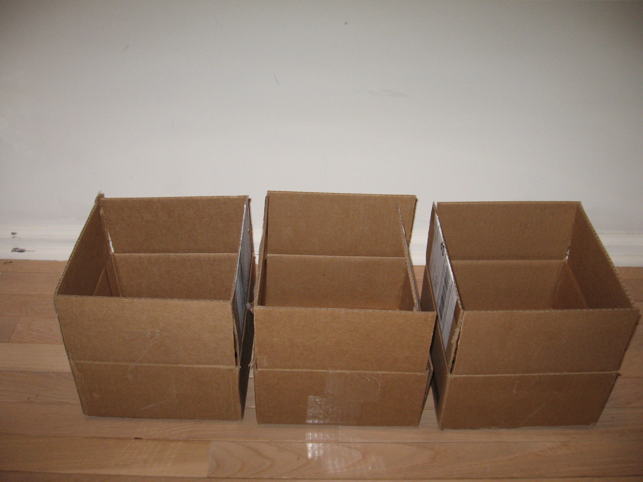 six boxes are sitting on the floor in a box