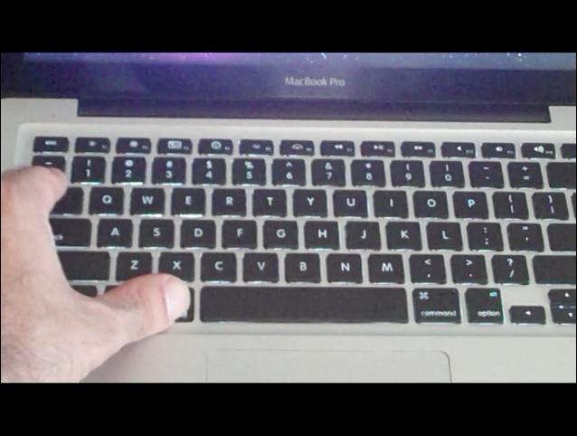 hands are typing on the keyboard of a laptop computer