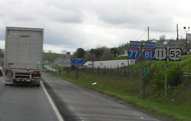 the truck and the car have stopped on the roadway