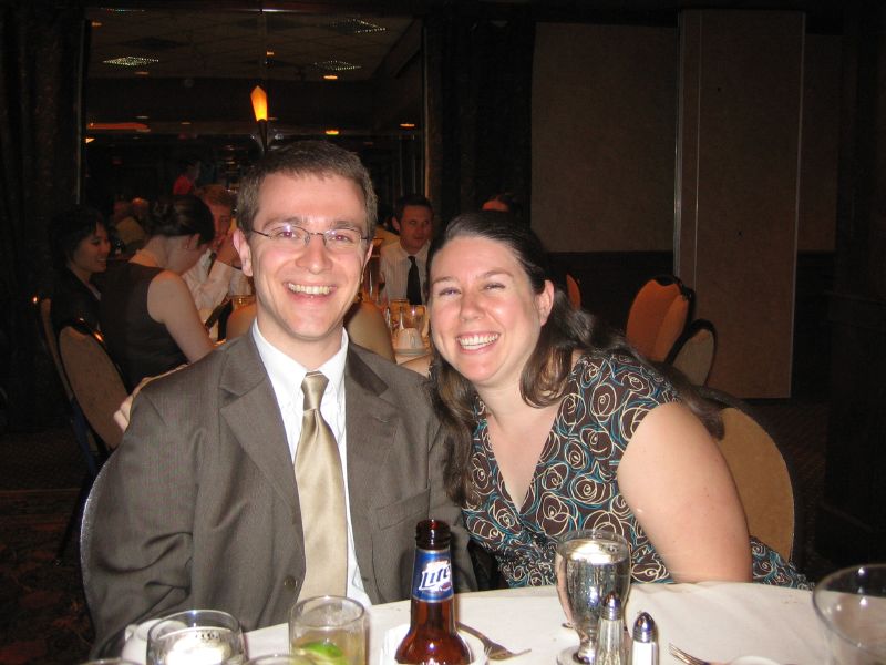 a couple smiling for the camera at a formal event