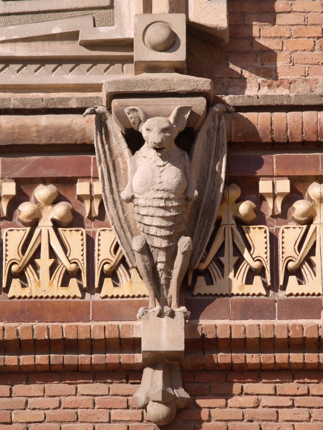 a bird statue on the outside of a building