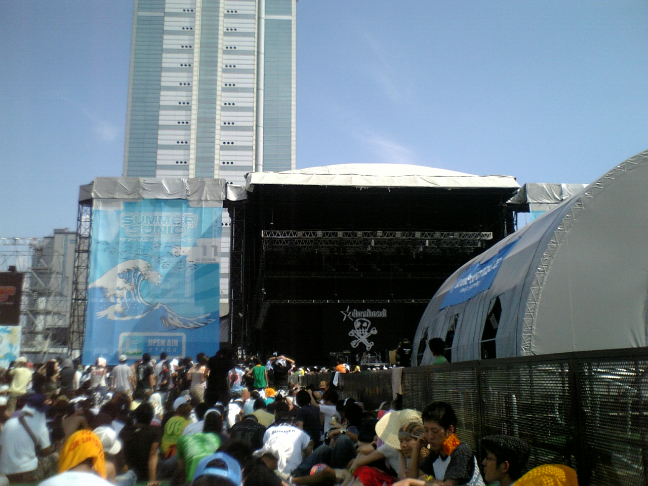 a crowd of people are watching a concert