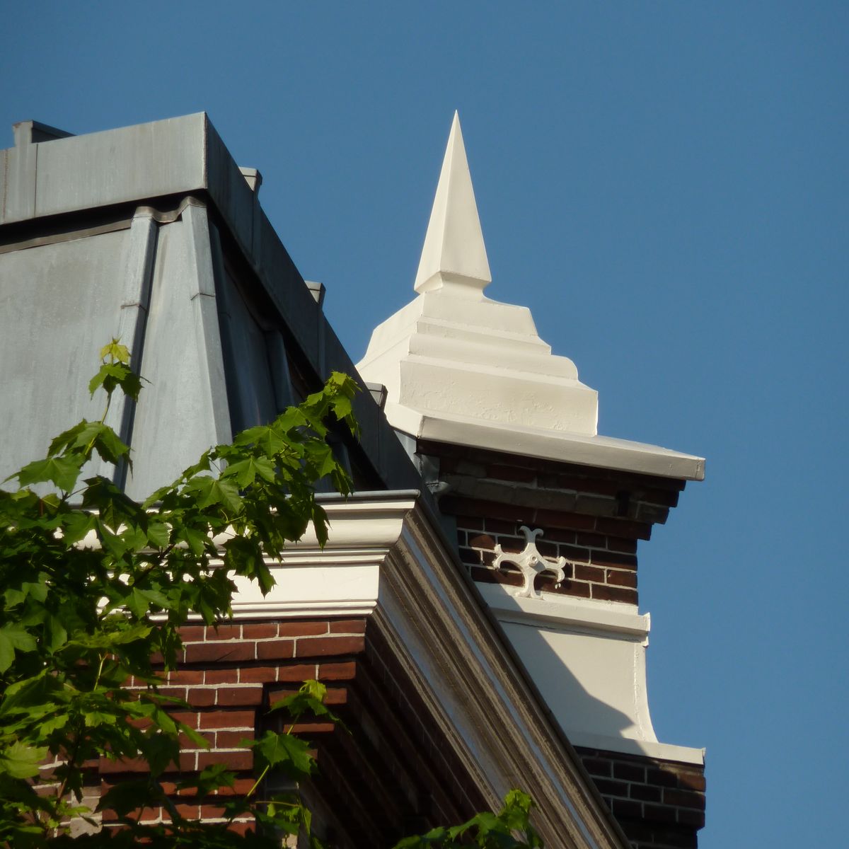the roof and chimney of a brick building