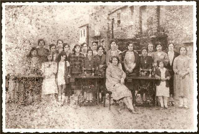 this is a group of women standing in front of a table