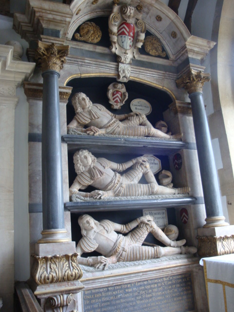 an ornate display with statues on the shelves