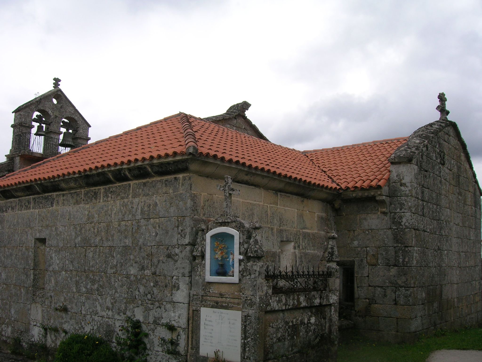 an old building with a red roof and a bell tower