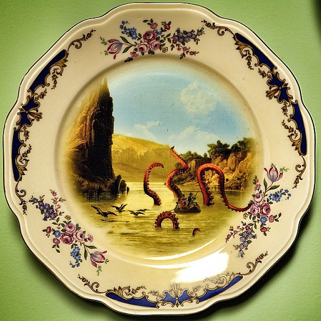 an ornate plate with a painting on it