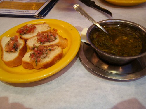 a yellow plate topped with bread and sauce