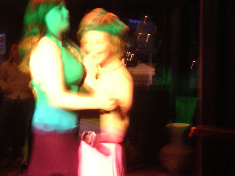 a blurry picture of two people dancing together