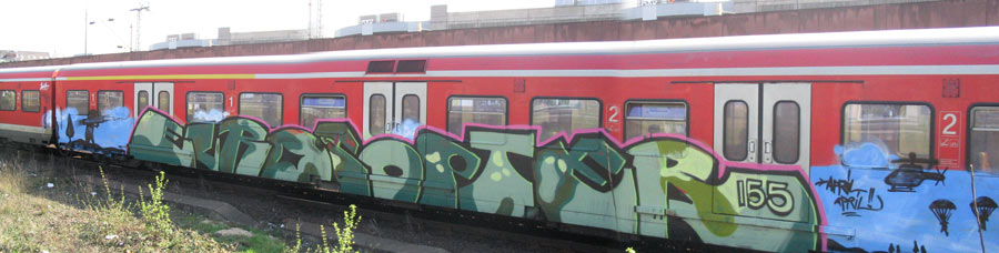 a red train car with graffiti on it
