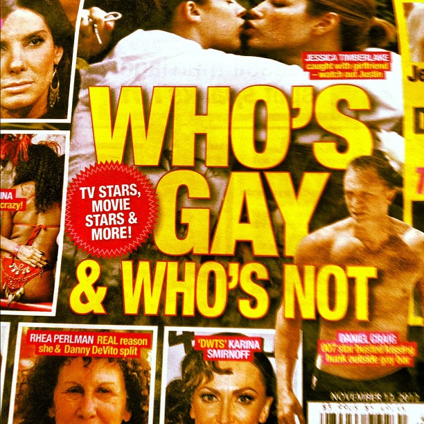 a couple kissing on the cover of who's gay magazine