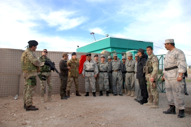 military men standing around talking to each other