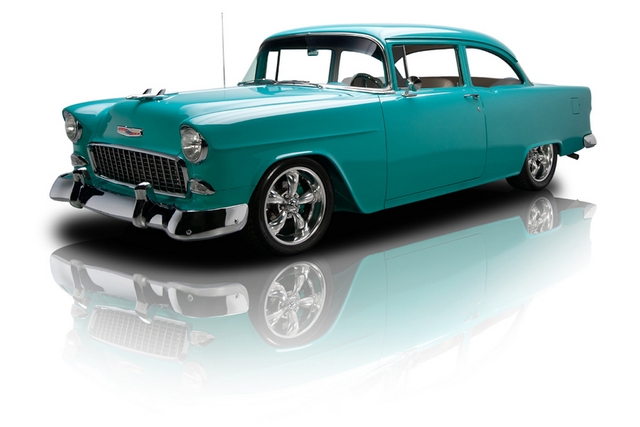 old style blue car with white background and reflection