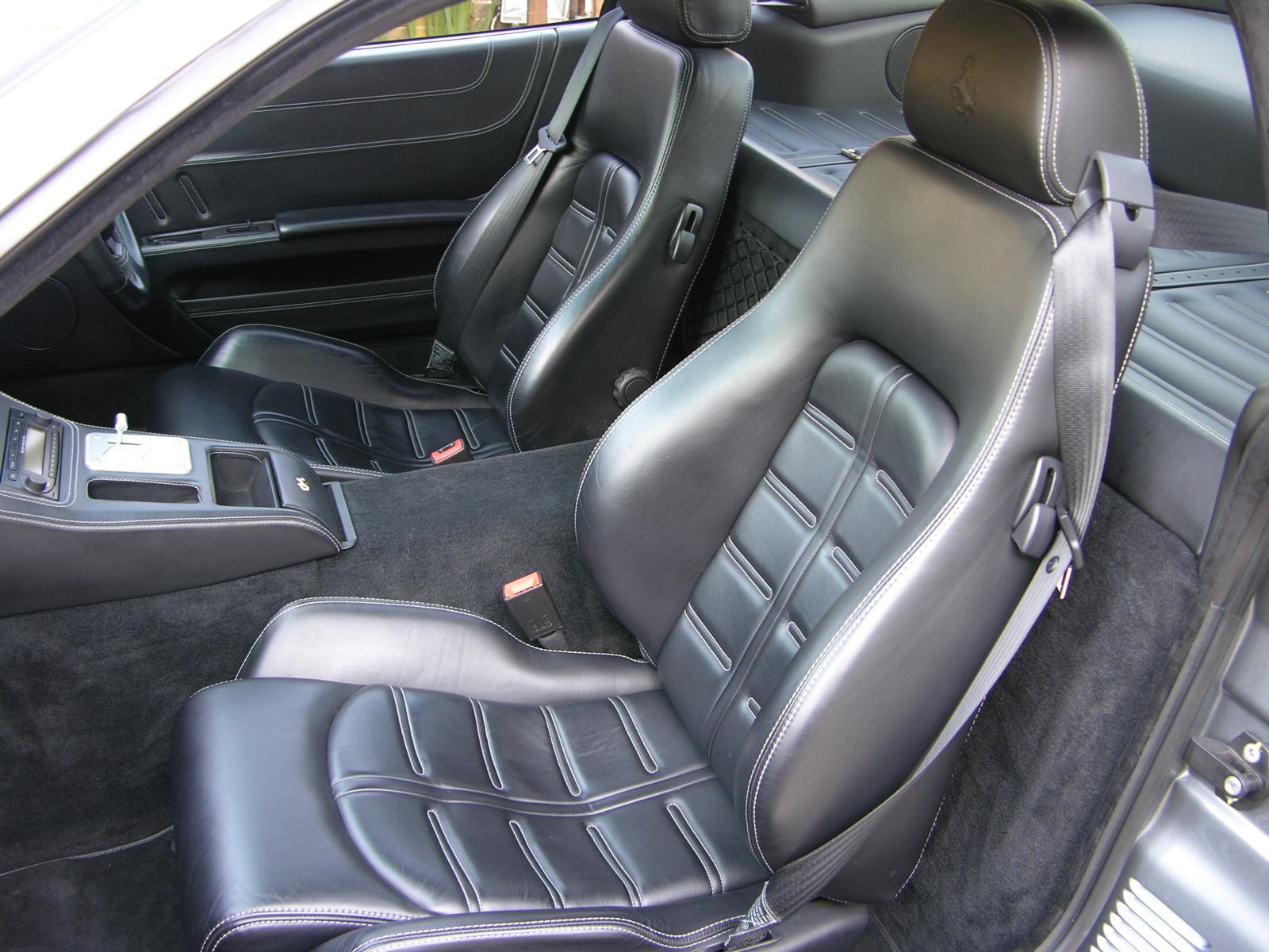 the interior of a modern car with modern leather seats