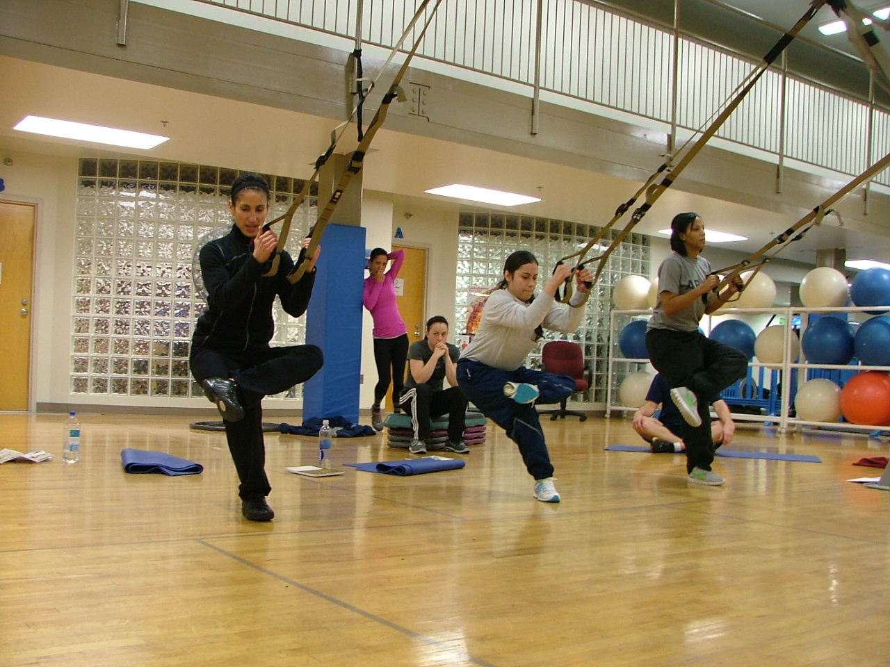 people on a gym doing aerial exercise