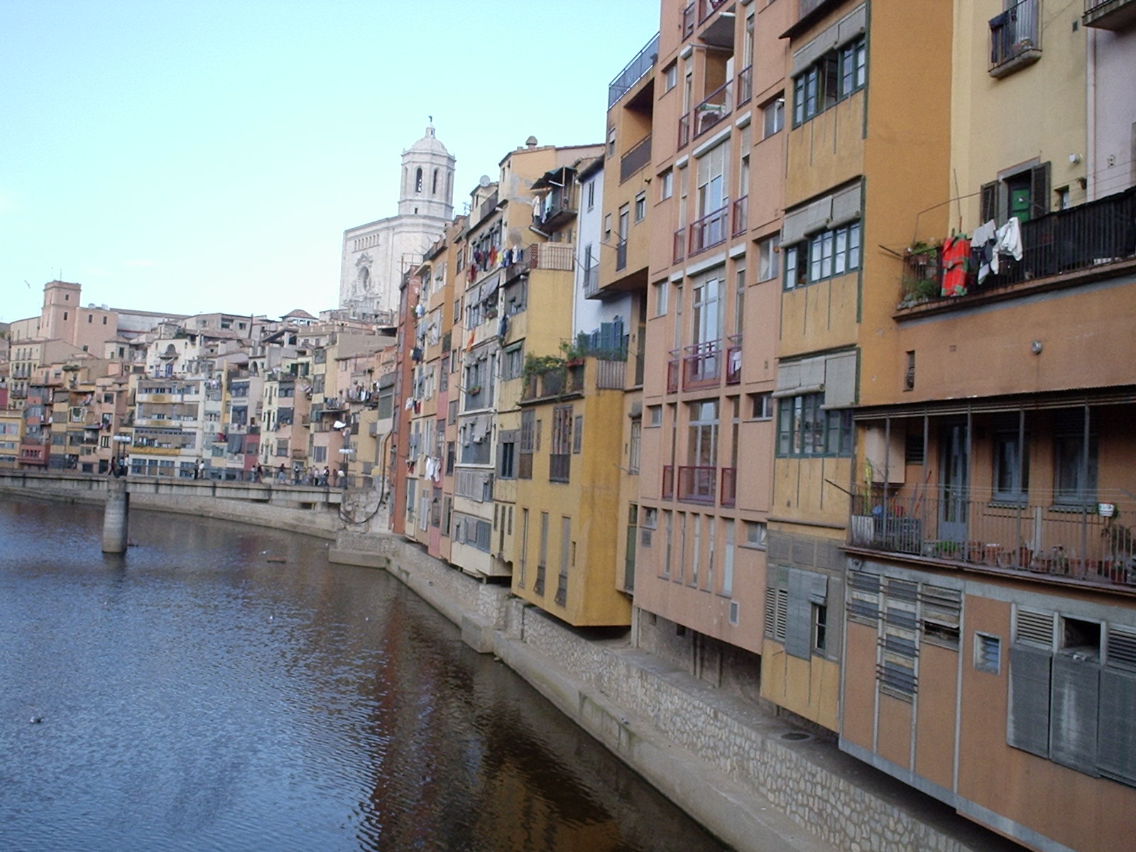 an empty river with lots of buildings lined up against the sides