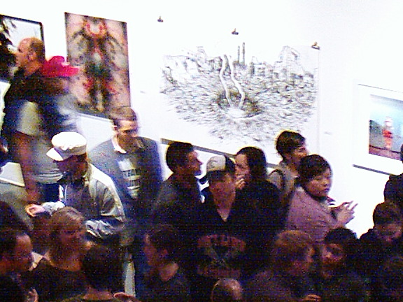 many people are crowded into the lobby to see soing on display