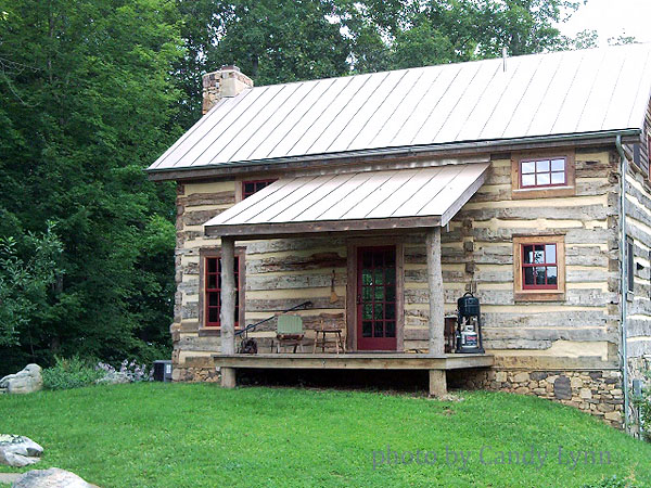 an old log cabin that is standing in the woods