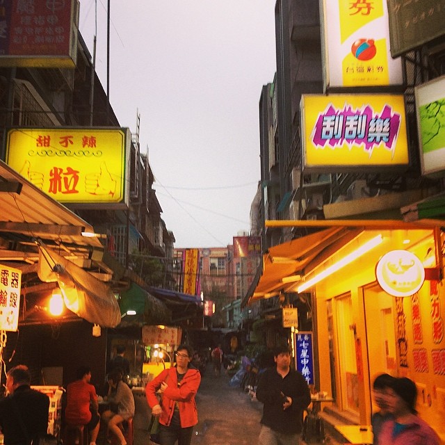 a busy chinese street during the evening