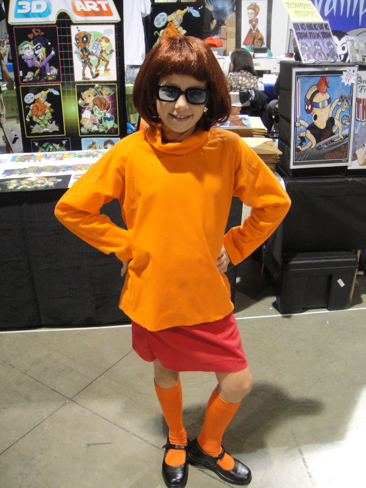 a person in orange and black is standing