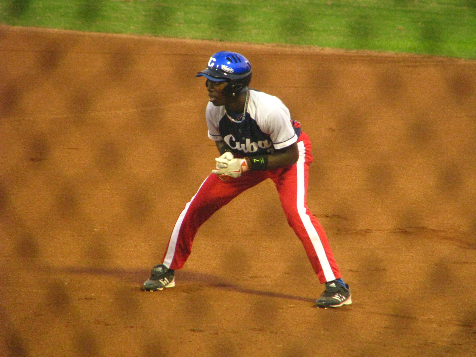 a baseball player standing on the base during a baseball game