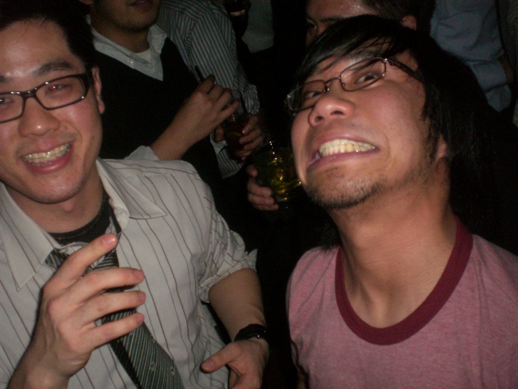 two guys are having fun at a party