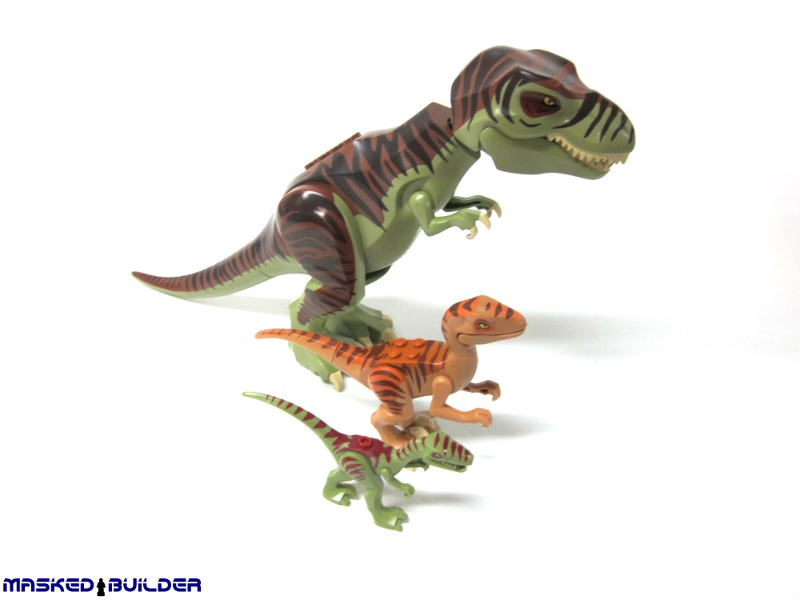 a close up view of two toy dinosaurs on a white background