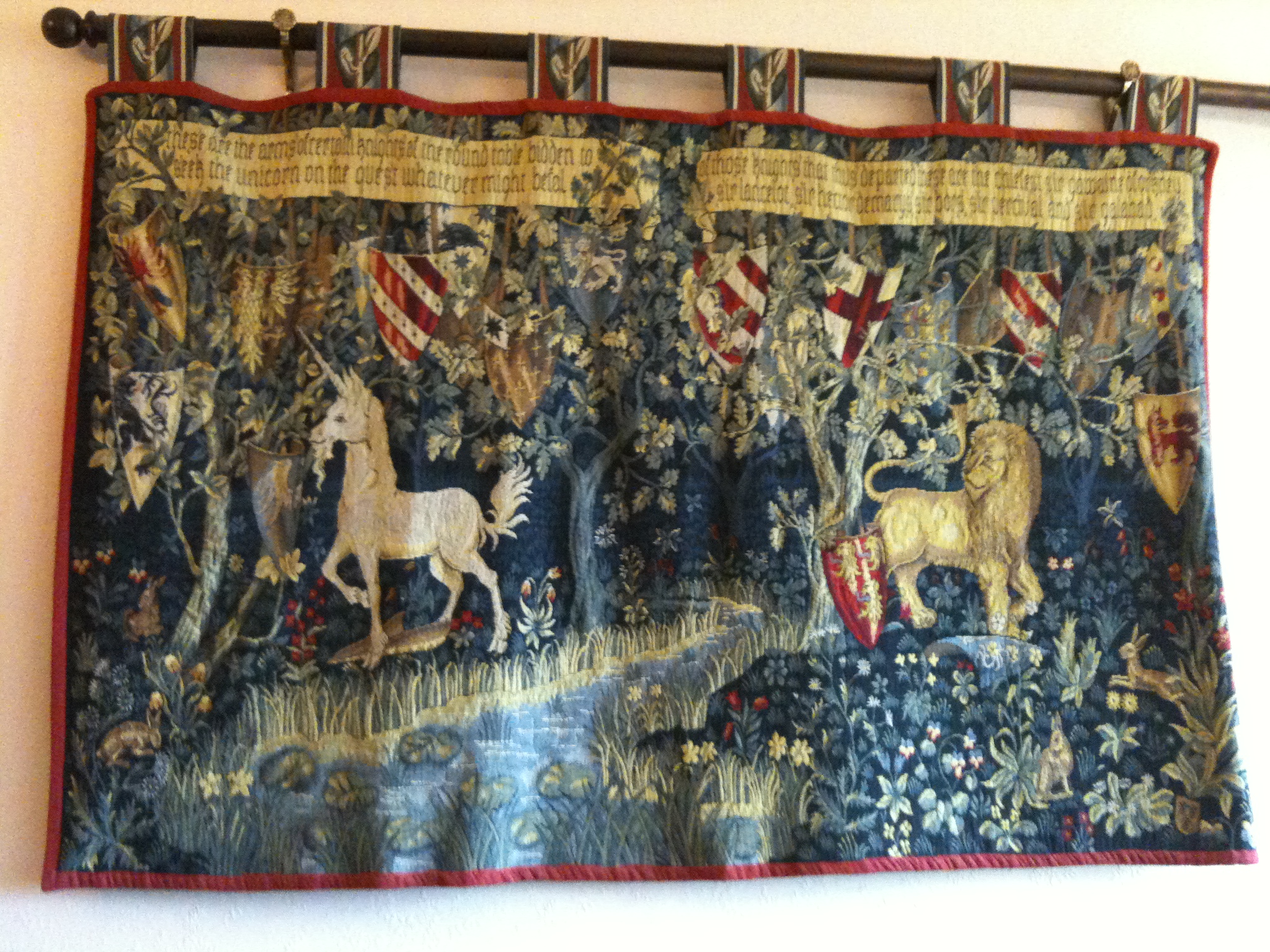 a tapestry hanging on the wall shows an old american style