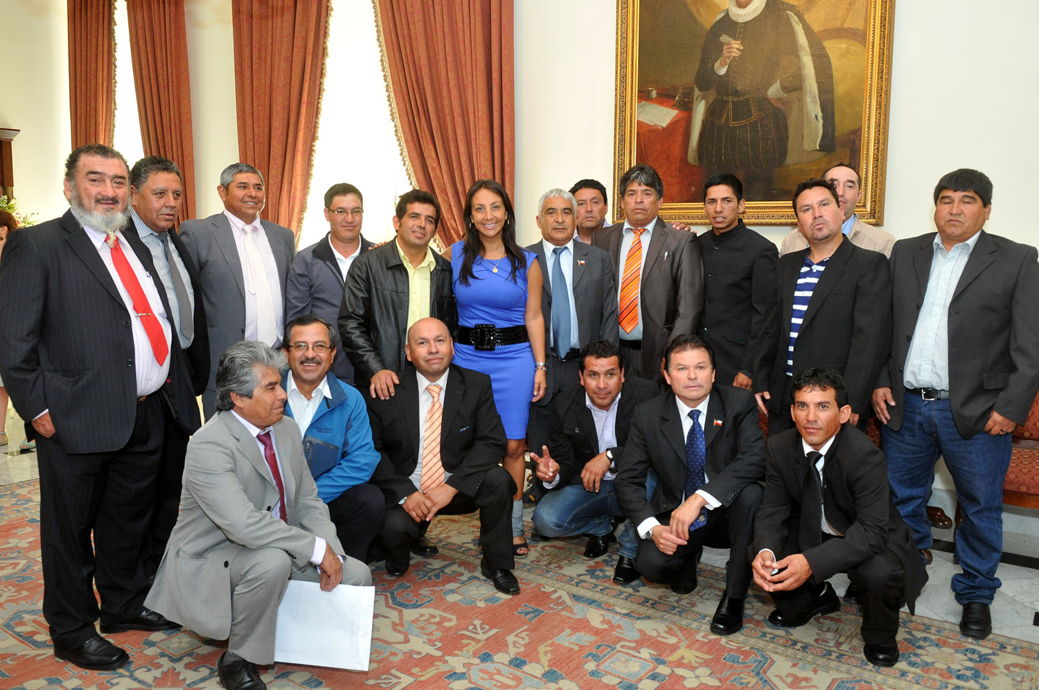 there are people in suits and ties posing together