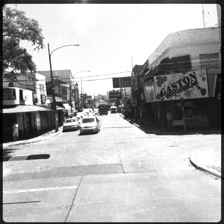 a black and white po of cars driving on the road