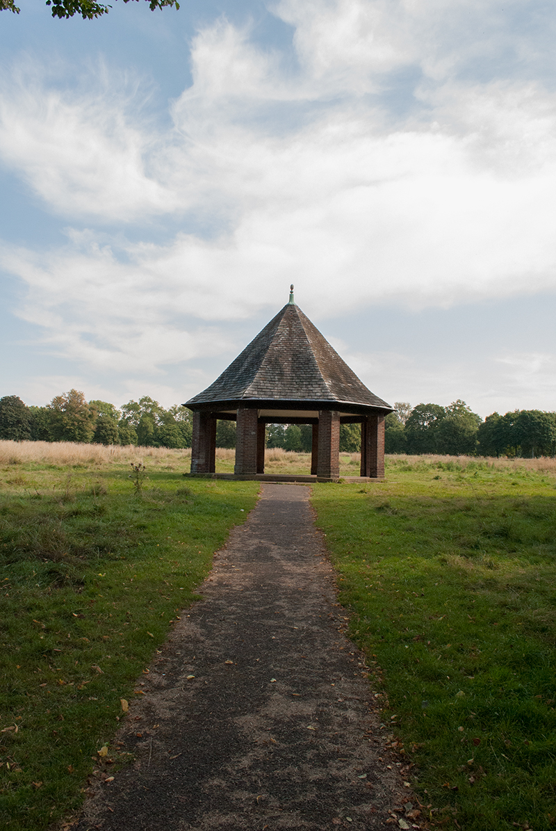 this is a view from the ground of a walkway leading to a gazebo