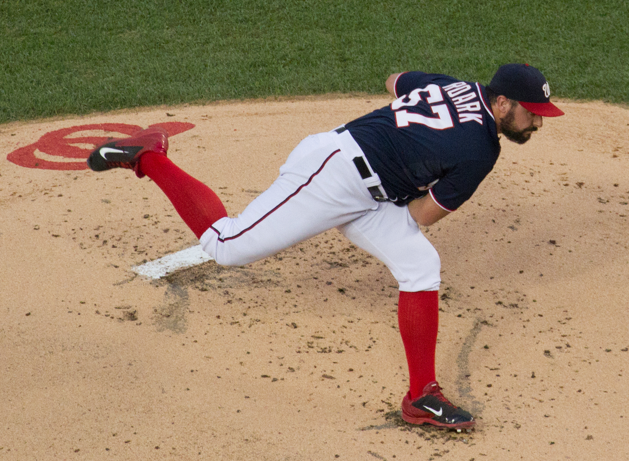 a pitcher is pitching a ball in the game