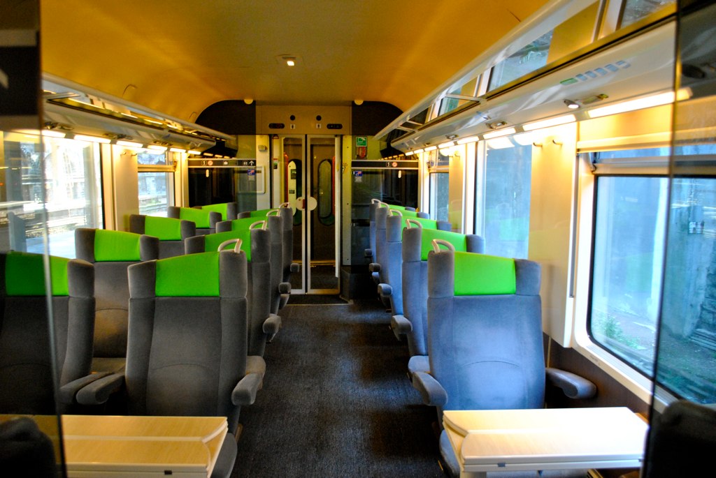 the empty seats in this train are very colorful