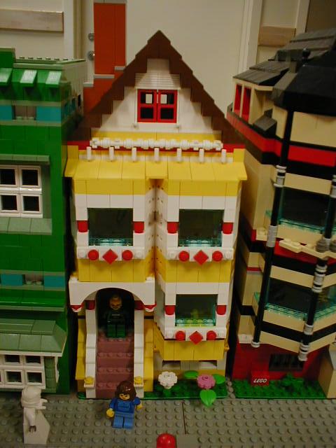 a set of multicolored lego toys with buildings