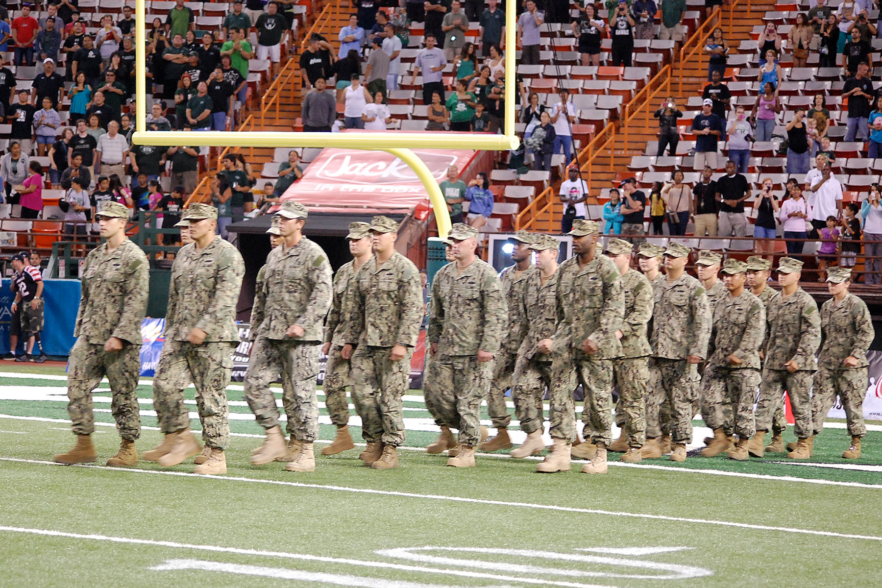 a group of military men walk off the field