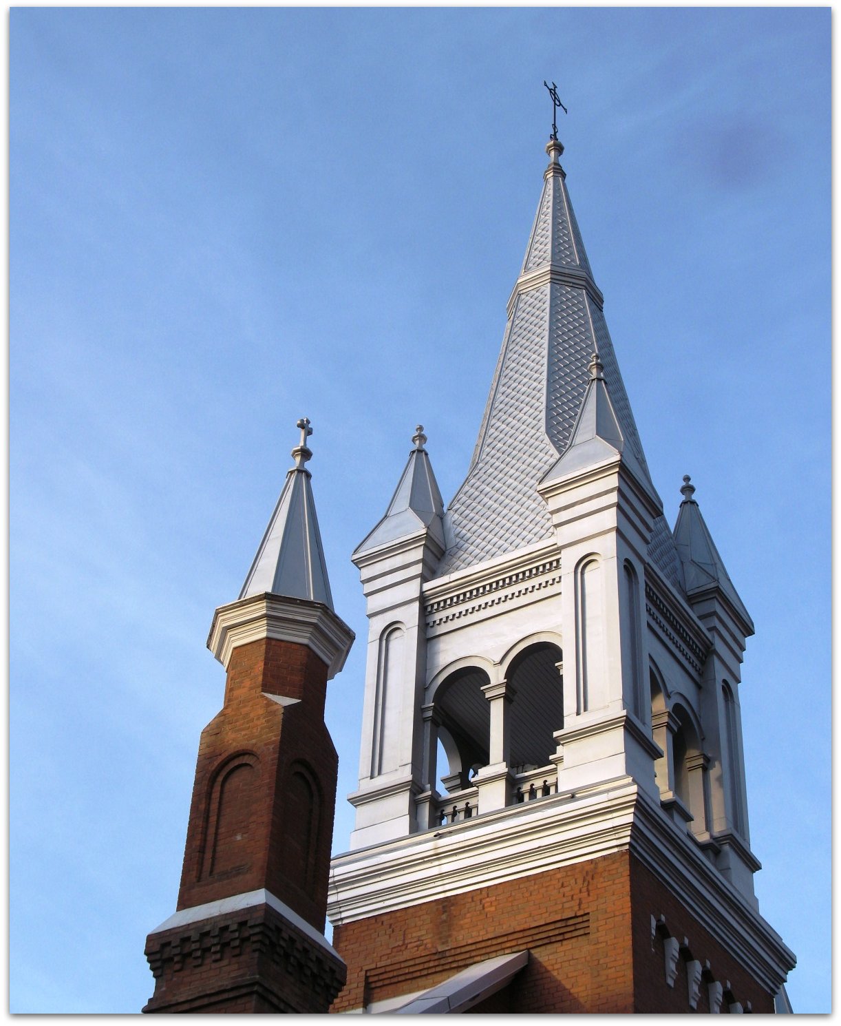 a church with an ornate tower and roof