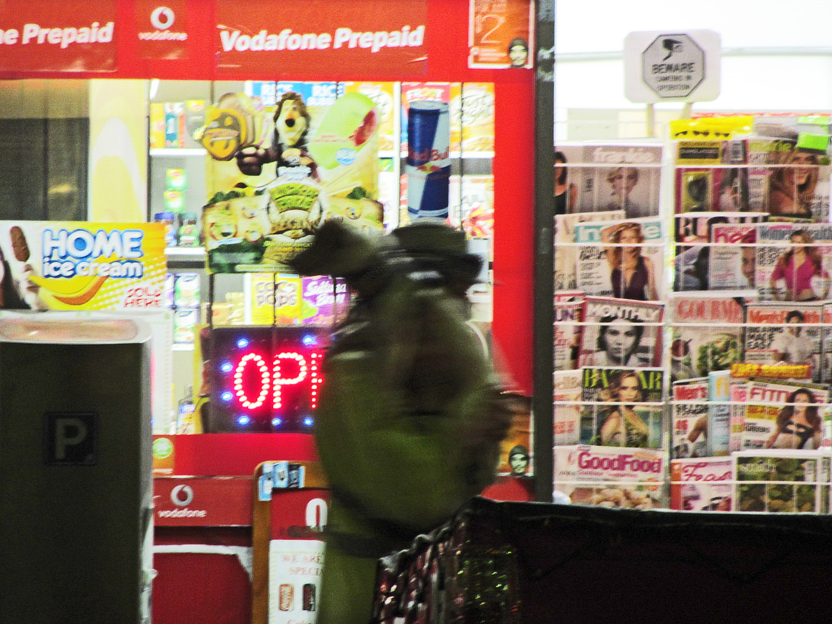 the back side of a store front filled with magazines