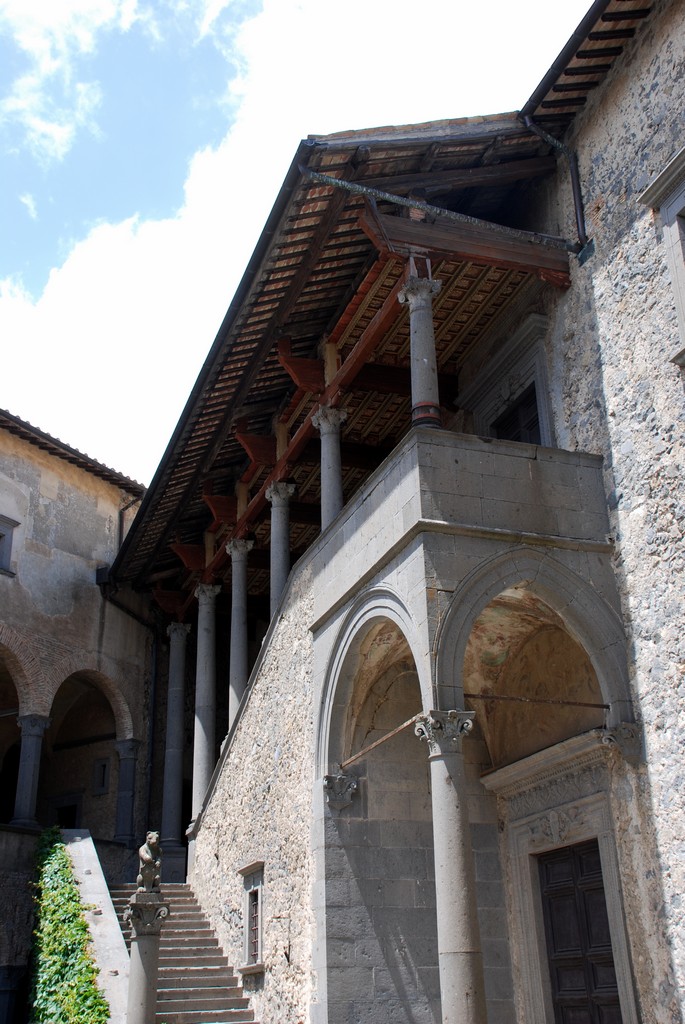 large stone building with columns and a stair way