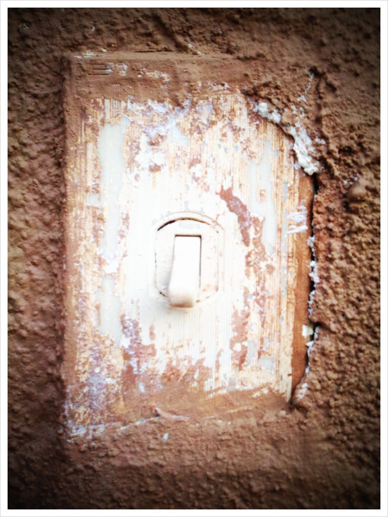 a square hole on a wall with white light